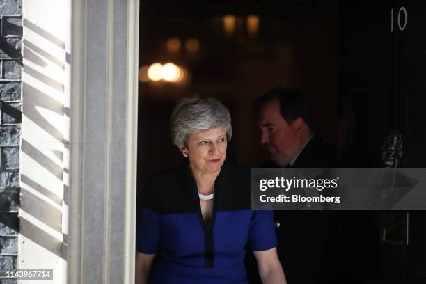 Theresa May, U.K. Prime minister, walks to greet Jens Stoltenberg, secretary general of the North Atlantic Treaty Organization , ahead of their...