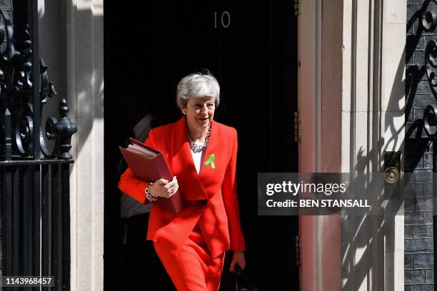 Britain's Prime Minister Theresa May leaves 10 Downing Street in London on May 15 ahead of the weekly Prime Minister's Questions question and answer...