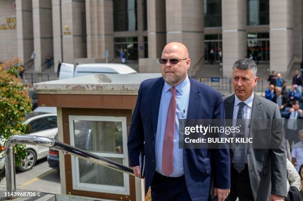 Embassy charge d'affaires Jeffrey Hovenier leaves the Caglayan courthouse on May 15 in Istanbul, after US consular staffer Metin Topuz was ordered to...