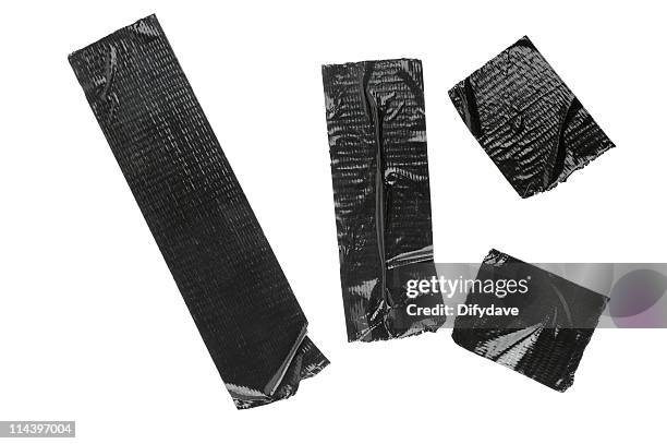 pieces of black duct tape isolated on white - duct tape stockfoto's en -beelden