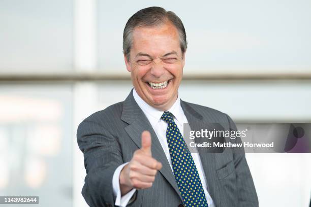 Leader of the Brexit Party Nigel Farage gives a thumbs up sign at the Senedd in Cardiff Bay on May 15, 2019 in Cardiff, Wales. Nigel Farage, leader...