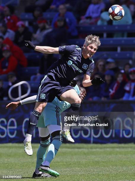 Bastian Schweinsteiger of Chicago Fire leaps over Kei Kamara of Colorado Rapids for a header at SeatGeek Stadium on April 20, 2019 in Bridgeview,...