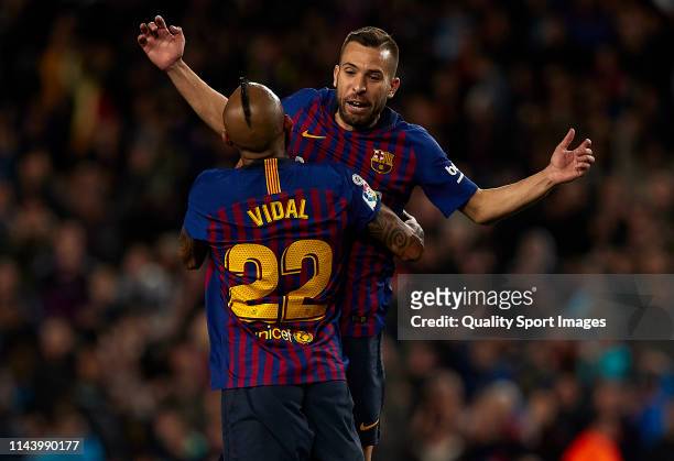 Jordi Alba of FC Barcelona celebrates with Arturo Vidal after scoring their team's second goal during the La Liga match between FC Barcelona and Real...