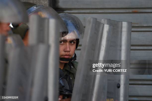 Members of Venezuela's Bolivarian National Guard blocks access to the Federal Legislative Palace, which houses both the opposition-led National...