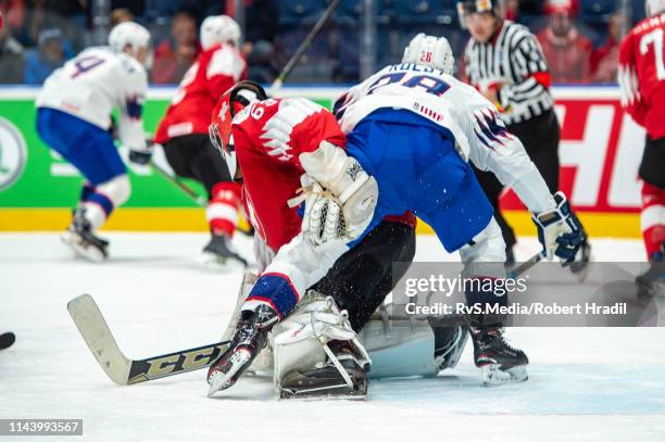 Kristian Forsberg of Norway clashes with Goalie Leonardo Genoni of Switzerland during the 2019 IIHF Ice Hockey World Championship Slovakia group game...