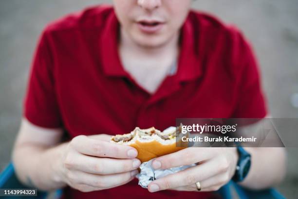 Hamburger In Hand High-Res Stock Photo