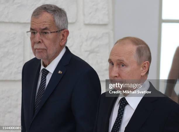 Russian President Vladimir Putin and Austrian President Alexander Van der Bellen enter the hall during their joint press conference at Rus...