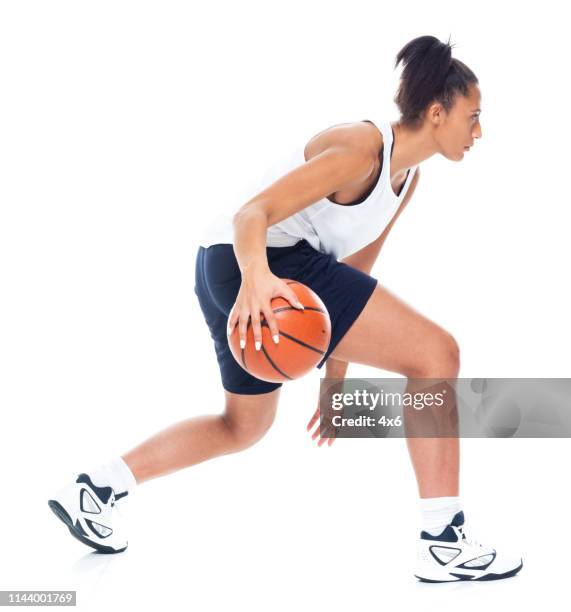 attractive african american female playing basketball - basketball player stock pictures, royalty-free photos & images