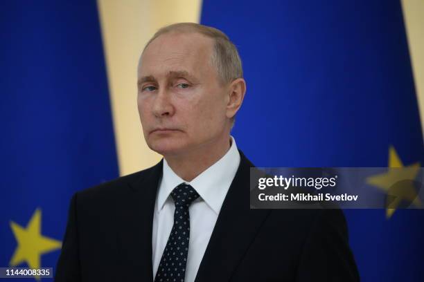 Russian President Vladimir Putin speaks during a joint press conference with Austrian President Alexander Van der Bellen during a meeting on May 15,...