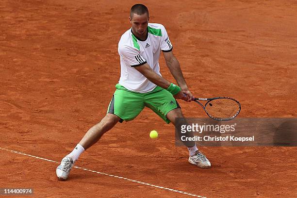 Viktor Troicki of Serbia plays a backhand during the blue group match between Viktor Troicki of Serbia and Marcel Granollers of Spain during day five...