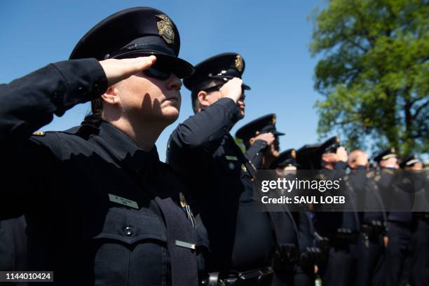 Members of police departments salute during the 38th Annual National Peace Officers' Memorial Service honoring law enforcement officers who were...