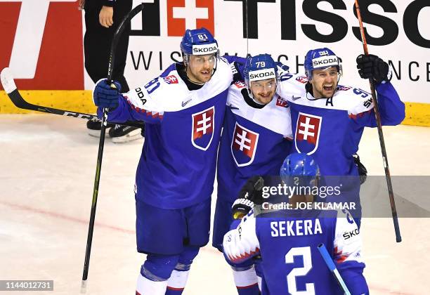 Slovakia's players celebrate after scoring during the group A stage match Germany vs Slovakia of the 2019 IIHF Ice Hockey World Championship at Steel...