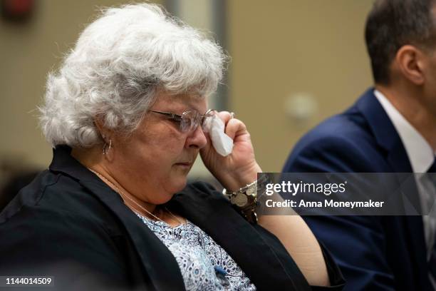 Susan Bro, mother of Heather Heyer reacts as she watches footage from the 2017 Unite The Right rally in a House Civil Rights and Civil Liberties...