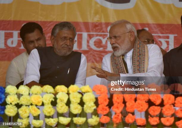 Prime Minister Narendra Modi and Bihar Deputy Chief Minister Sushil Kumar Modi speak during an election campaign rally ahead of the last phase of the...