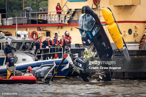 Helicopter that crashed in the Hudson River is pulled out of the water, May 15, 2019 in New York City. The pilot survived the incident. The pilot was...