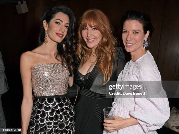 Amal Clooney, Charlotte Tilbury and Tessa Ferrer attend the London Premiere after party for new Channel 4 show "Catch-22", based on Joseph Heller's...