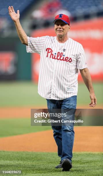 Actor Bruce Willis throws ceremonial pitch at the Milwaukee Brewers v Philadelphia Phillies game at Citizens Bank Park on May 15, 2019 in...