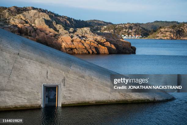 Picture taken on May 1, 2019 shows a view of Under, a restaurant that is semi-submerged beneath the waters of the North Sea in Lindesnes near...