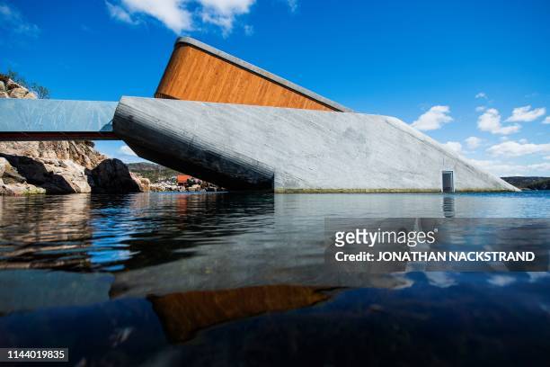 Picture taken on May 2, 2019 shows a view of Under, a restaurant that is semi-submerged beneath the waters of the North Sea in Lindesnes near...