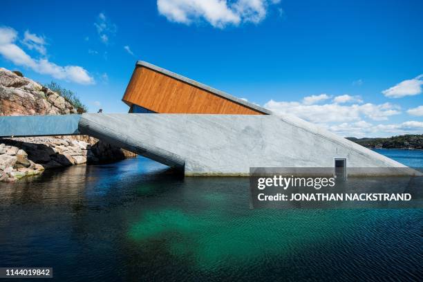 Picture taken on May 2, 2019 shows a view of Under, a restaurant that is semi-submerged beneath the waters of the North Sea in Lindesnes near...