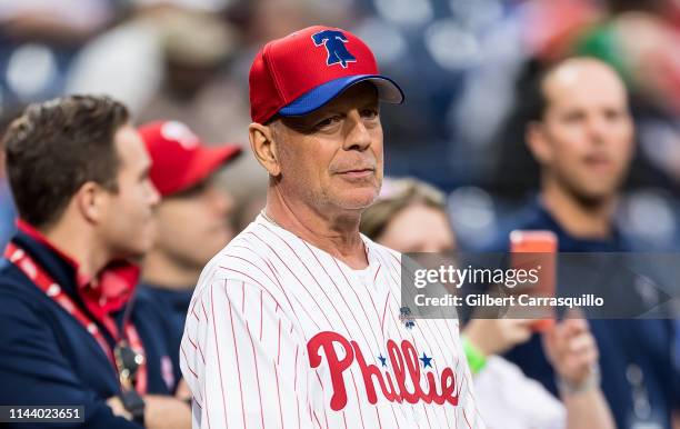 Actor Bruce Willis throws ceremonial pitch at the Milwaukee Brewers v Philadelphia Phillies game at Citizens Bank Park on May 15, 2019 in...