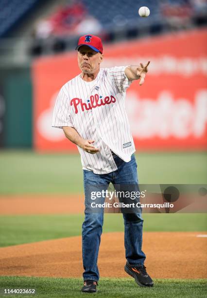 Actor Bruce Willis throws ceremonial pitch at the Milwaukee Brewers v Philadelphia Phillies game at Citizens Bank Park on May 15, 2019 in...