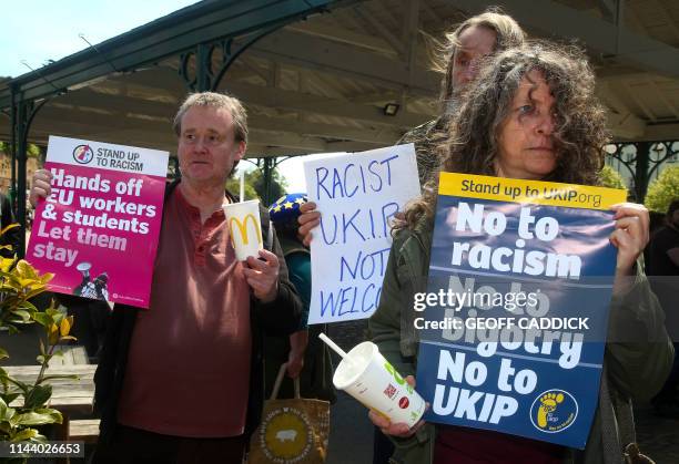 Anti-UKIP protesters opposed to UK Independence Party European Election candidate Carl Benjamin, known by the online pseudonym Sargon of Akkad, hold...