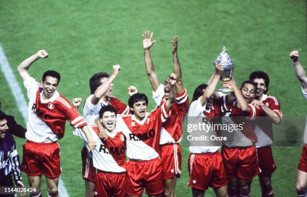 Youri Djorkaeff, Rui Barros, Ramon Diaz, Luc Sonor, Marcel Dib, Gerald Passi, Claude Puel celebrate winning during the French cup final between...