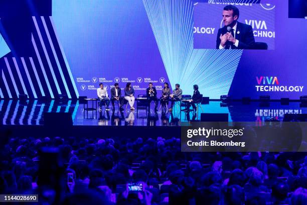 Emmanuel Macron, France's president, center, speaks on stage with young start up entrepreneurs at the Viva Technology conference in Paris, France, on...