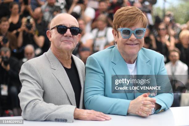 British singer-songwriter Elton John and British screenwriter Bernie taupin pose during a photocall for the film "Rocketman" at the 72nd edition of...