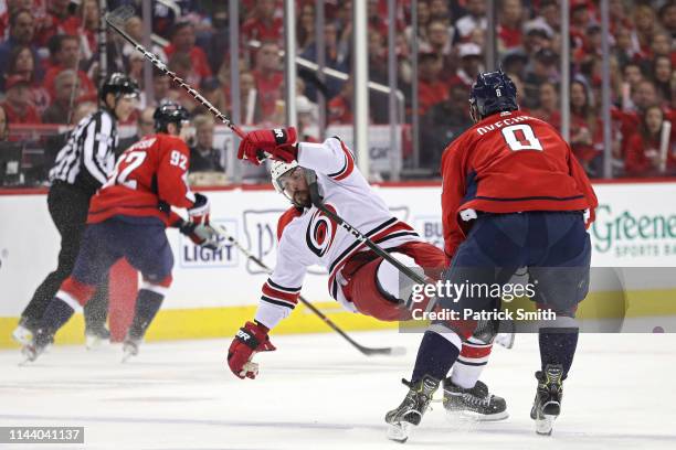 Alex Ovechkin of the Washington Capitals checks Justin Faulk of the Carolina Hurricanes in the first period in Game Five of the Eastern Conference...