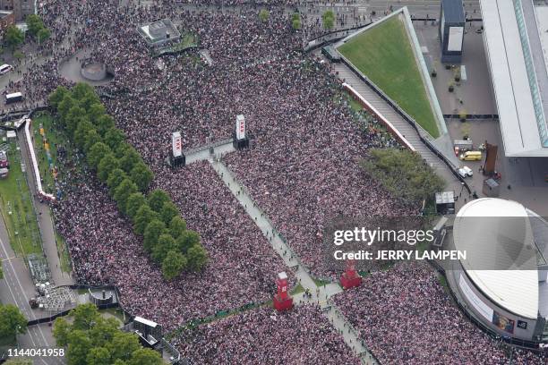 Ajax Amsterdam football supporters gather on the Museumplein in Amsterdam to celebrate with players the club's 34th national champion title after...