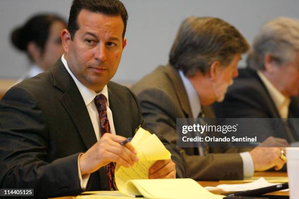 Jose Baez, left, lead defense counsel for Casey Anthony, looks over at the prosecution while preparing for tenth day of jury selection in Casey...
