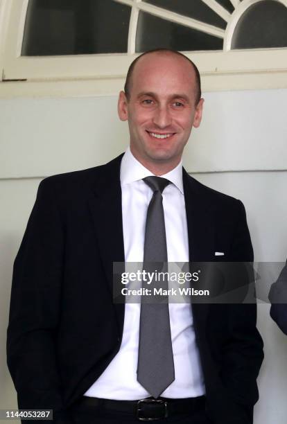 Senior Advisor Stephen Miller listens as U.S. President Donald Trump speaks about immigration reform in the Rose Garden of the White House on May 16,...