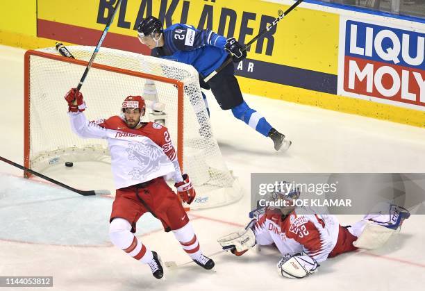 Finland's forward Kaapo Kakko celebrate scoring past Denmark's goalkeeper Sebastian Dahm during the IIHF Men's Ice Hockey World Championships Group A...