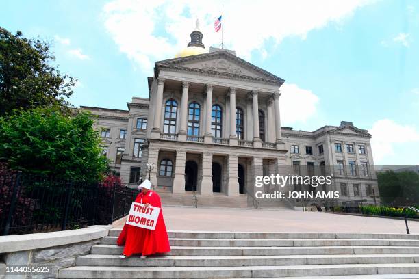 Activist Tamara Stevens with the Handmaids Coalition of Georgia leaves the Georgia Capitol after Democratic presidential candidate Sen. Kirsten...
