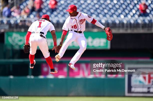 Wilmer Difo and Victor Robles of the Washington Nationals celebrate after the Nationals defeated the New York Mets 7-6 at Nationals Park on May 16,...