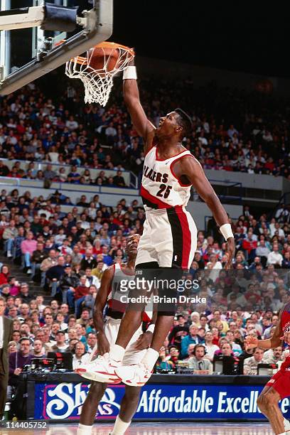 Jerome Kersey of the Portland Trailblazers dunks at the Veterans Memorial Coliseum in Portland, Oregon circa 1992. NOTE TO USER: User expressly...