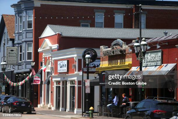 Shops line Atwells Avenue in the Federal Hill neighborhood in Providence, RI on May 7, 2019.