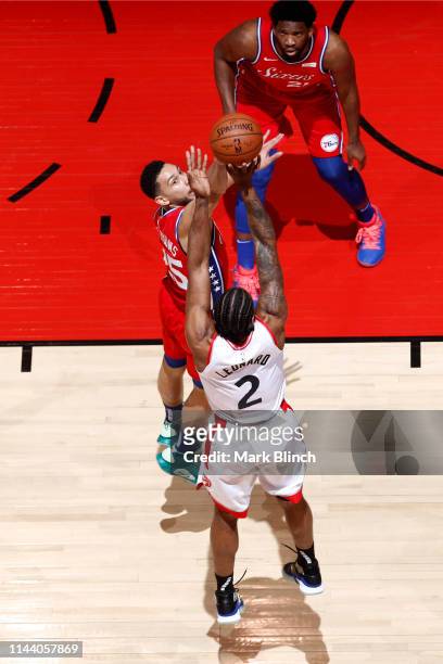 Kawhi Leonard of the Toronto Raptors shoots the ball over Ben Simmons of the Philadelphia 76ers during Game Seven of the Eastern Conference...