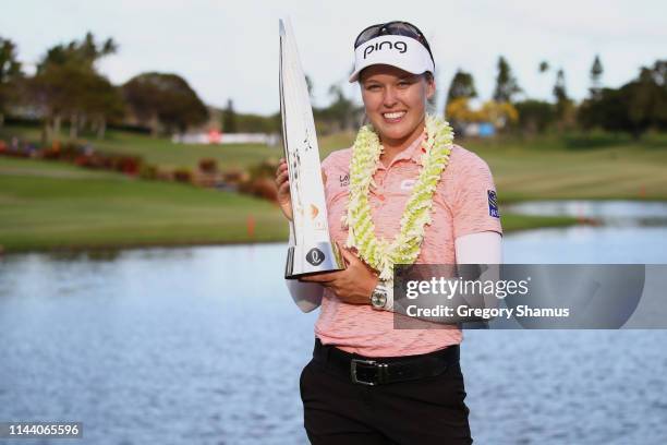 Brooke Henderson poses with the trophy after winning the LOTTE Championship at Ko Olina Golf Club on April 21, 2019 in Kapolei, Hawaii.