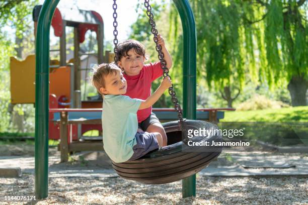 three years old children playing in the park playground - 2 3 years stock pictures, royalty-free photos & images