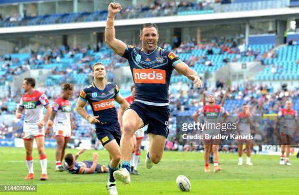 Michael Gordon of the Titans celebrates scoring a try during the round 6 NRL match between the Titans and the Knights at Cbus Super Stadium on April...