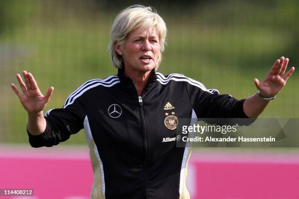 Silvia Neid, head coach of team Germany gives instructions to her players during a training session of the German national woman team at the adidas...