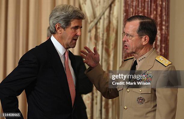 Sen. John Kerry speaks with Chairman of the Joint Chiefs of Staff Adm. Michael Mullen prior to an address at the State Department by U.S. President...