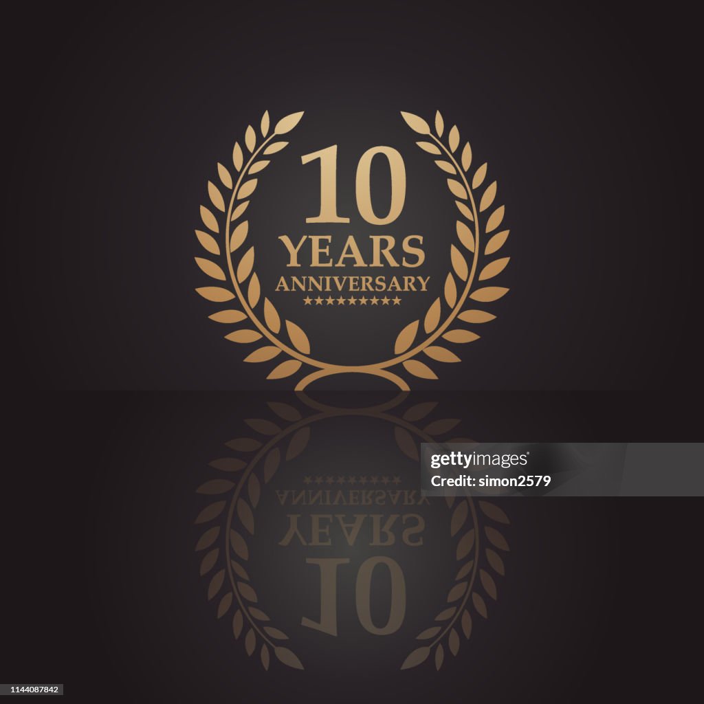 Ten years golden anniversary icon with dark color background