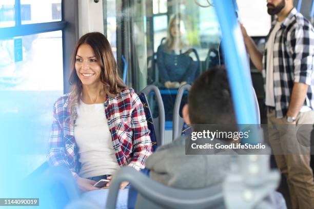 young woman riding on a public transportation - shuttle bus stock pictures, royalty-free photos & images