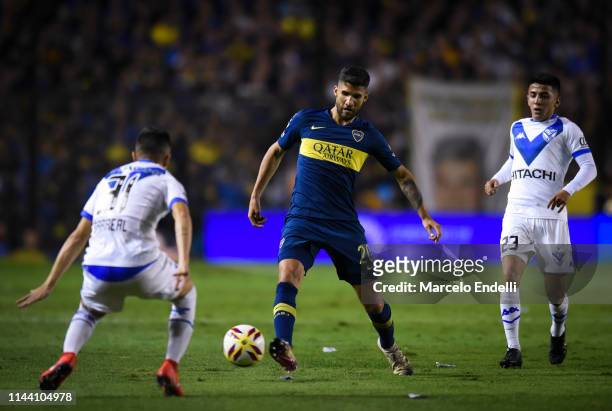 Lisandro Lopez of Boca Juniors kicks the ball during a Quarter Final second leg match between Boca Juniors and Velez Sarsfield as part of Copa de la...