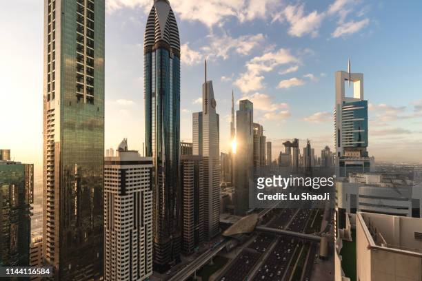 city skyline and cityscape at sunrise in dubai.uae - expo 2020 dubai stock pictures, royalty-free photos & images