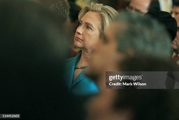 Secretary of State Hillary Clinton listens to U.S. President Barack Obama speak at the State Department on May 19, 2011 in Washington, DC. President...